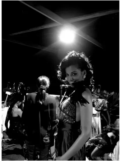 A behind the scenes shot of the spotlight rebel, Mugdha Godse, during a shoot featuring a stunning Falguni Shane Peacock creation.