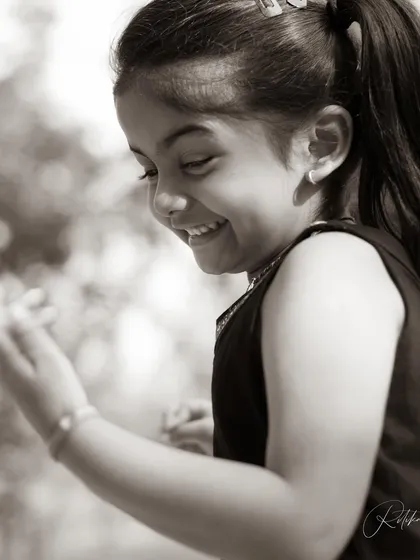 A black and white shot capturing a moment of quiet laughter. Even in her most energetic moments, there are these soft, beautiful expressions that are so wonderful to freeze in time.