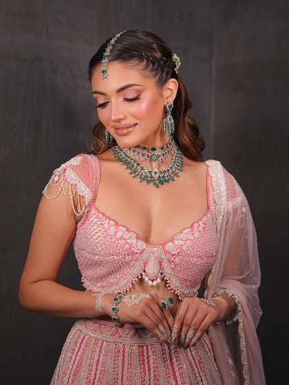 A serene moment. The soft, glowing makeup is perfect for a romantic and dreamy bridal look.