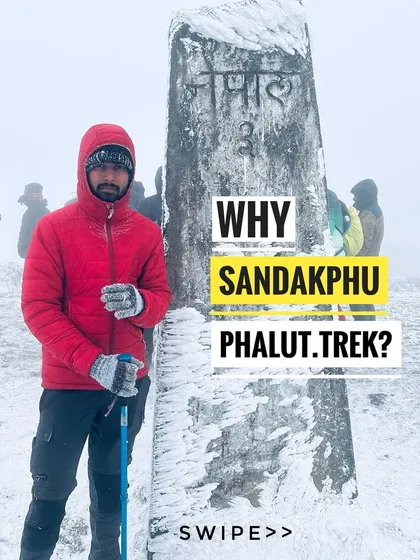 A trekker stands by the ice covered border pillar marking the Nepal border on the Sandakphu trek. This unique trail runs along the international border between India and Nepal.
