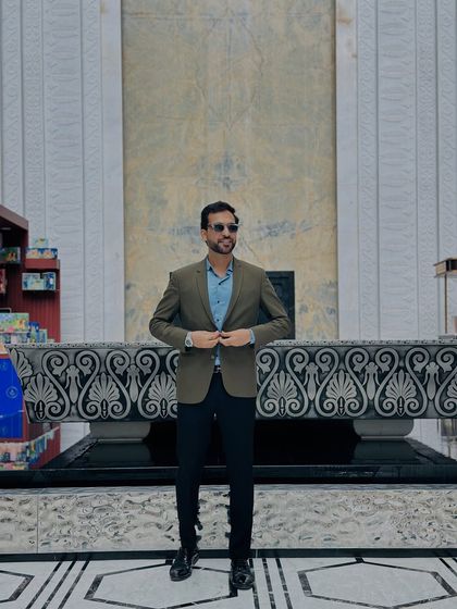 Adjusting my blazer, ready for action. This shot captures the feeling right before I go on stage, focused and prepared to deliver a killer performance.