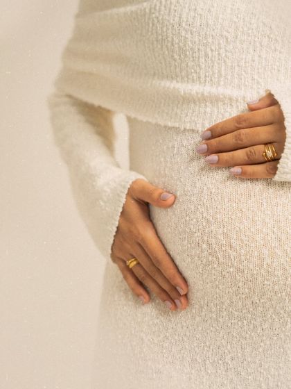 The tiny details matter most. A close-up of hands gently cradling the bump tells a story of love, protection, and anticipation. This shot focuses on the profound connection between mother and child.