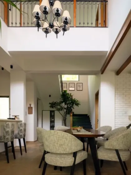 The double-height dining and living area at Villa Shai, which received an Honourable Mention at the IDA. The open-plan design creates a sense of grandeur, while the mix of materials keeps the space grounded and inviting.