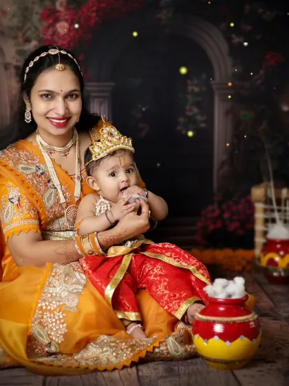 A mother and her baby dressed as Krishna share a loving moment. These portraits are a beautiful way to celebrate the festival and your bond with your child.