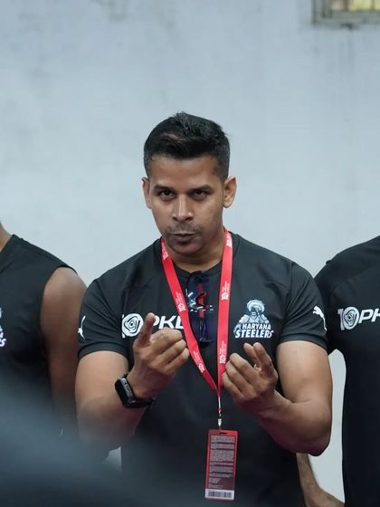 The hands do the talking. Using gestures to emphasize a point during a team talk.