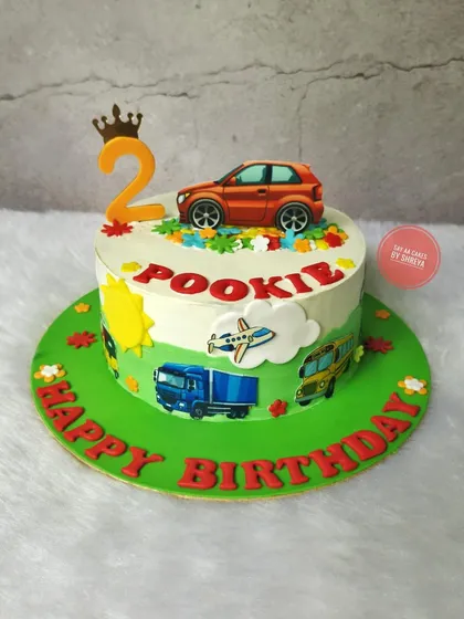 For the little one who loves all things that go. This transportation-themed cake features edible images of a truck, bus, and airplane around the side, with a toy car on top for the birthday boy to keep.