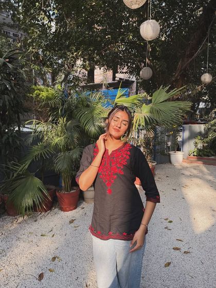 Eyes closed, enjoying the winter sun. A peaceful and happy moment in a simple, comfortable outfit.