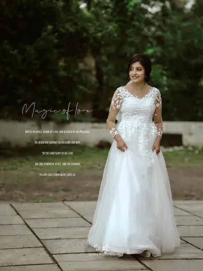 A full-length portrait of the bride in a beautiful outdoor setting, her elegant gown and serene smile telling a story of love.