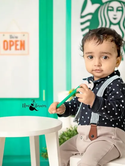 A thoughtful moment for our little coffee connoisseur. The detailed set, complete with tiny cups and bags, makes the scene come alive.