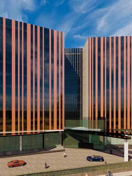 A render focusing on the entrance and drop-off area of the sustainable office building. The design features a cantilevered canopy that provides shelter while complementing the building's vertical facade lines.