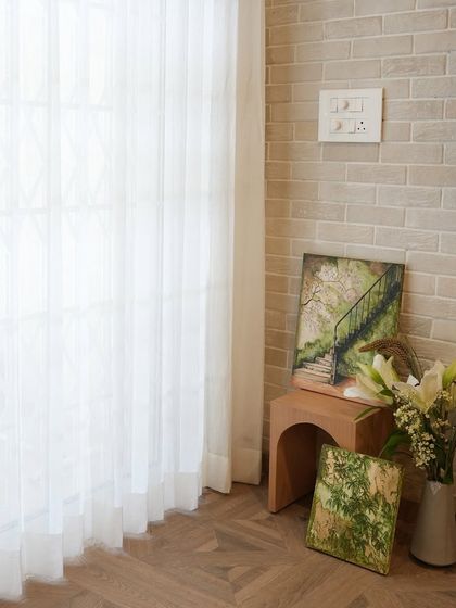 A quiet corner brought to life with my custom hand-painted wall art. This image shows two canvases with nature scenes, demonstrating how art can be displayed in unconventional ways to add color and inspiration to small spaces.