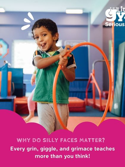 A toddler makes a silly face while playing with a hula hoop, a perfect example of learning through play. These moments of free expression are vital for emotional and social development.