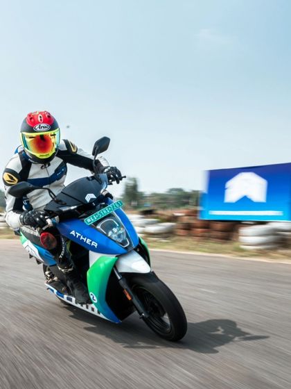 Hitting the apex on an Ather electric scooter during a practice session. These things are nimble and a ton of fun to ride on the limit.
