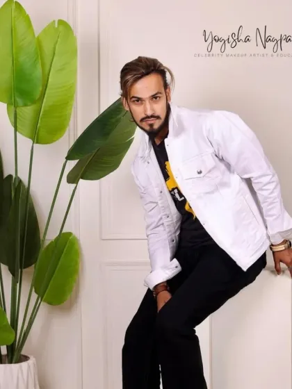 A closer look at the male model's makeup. The skin is even and fresh, and the features are subtly defined for a strong, photogenic result.