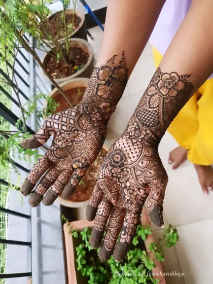 A lovely non-bridal Indian henna design, featuring a mix of florals and geometric patterns for a balanced look.