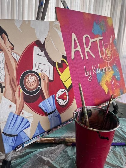 Another view of my easel during a workshop, with a work-in-progress next to my branded "ARTh by Kshama" canvas.