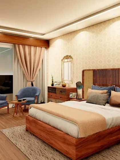 This bedroom design for a Gurugram apartment showcases our expertise in bespoke rattan and cane furniture. The warm wood tones of the bed frame and side tables are paired with soft, neutral fabrics and a classic wallpaper pattern, creating a timeless and soothing atmosphere.
