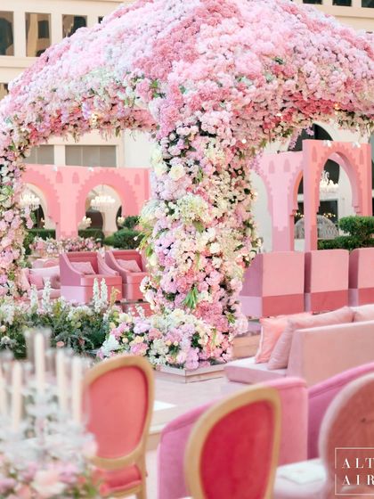 The stunning floral mandap at the 'Echoes of Pink' wedding in Doha. The design was a beautiful blend of our creative vision and the unique architectural charm of the city.