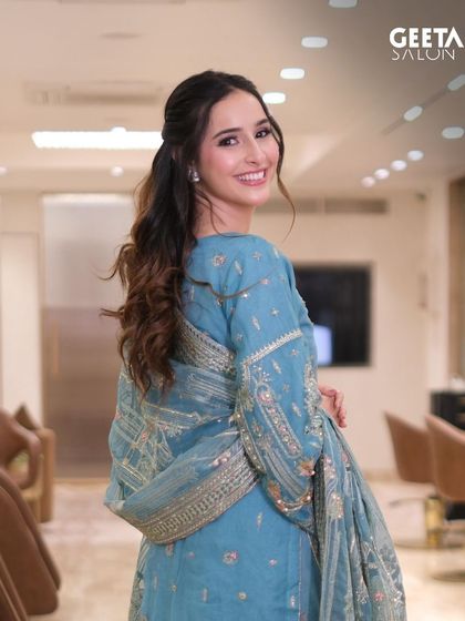 A smiling shot of Sadia Khateeb, showing how the complete look comes together to create a radiant and happy vibe.