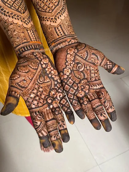 The palms of this design are filled with a dense checkerboard pattern, which always results in a fantastic stain. The forearms feature a complementary mix of traditional motifs.