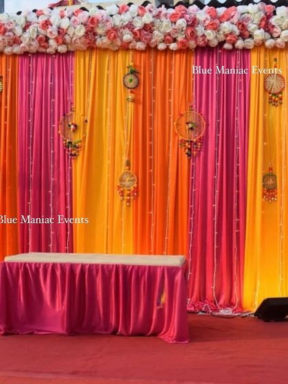 A wider view of the terrace Mehendi setup, showing the full backdrop and seating arrangement.