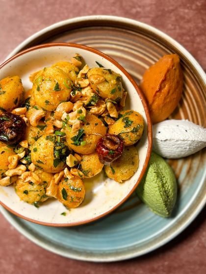 Our Gunpowder Idli is a house favorite and a perfect conversation starter for any event. These mini idlis are tossed in a flavorful spice mix and served with an assortment of chutneys for dipping.