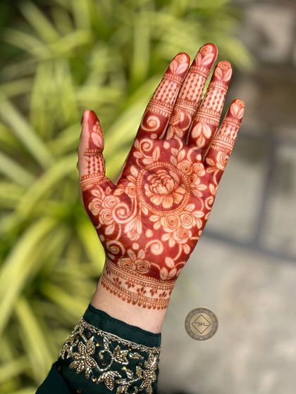 This is the fresh stain, just after the henna paste has been removed. It's a vibrant orange color that signals the start of the darkening process.