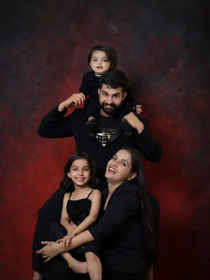 A fun and candid shot of the whole family laughing together. We always make sure to capture these genuine moments of joy during our sessions.