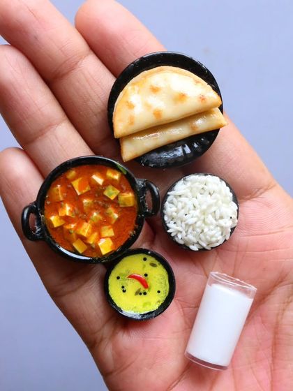 A handful of my North Indian miniatures, including paneer butter masala, chapati, and rice.