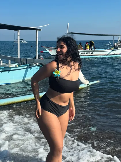 A candid shot of me laughing by the water. Your vacation should be filled with moments like these, and your outfits should be comfortable enough to let you live them fully.