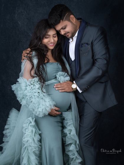 An intimate and loving embrace. This pose is perfect for capturing the quiet, strong bond between partners.