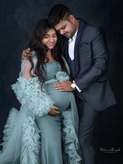 An intimate and loving embrace. This pose is perfect for capturing the quiet, strong bond between partners.