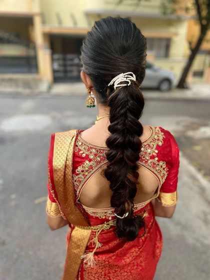 An elegant, simple, and quick braid hairstyle perfect for a home ceremony. The puff at the crown adds volume, and the simple accessory gives it a festive touch.