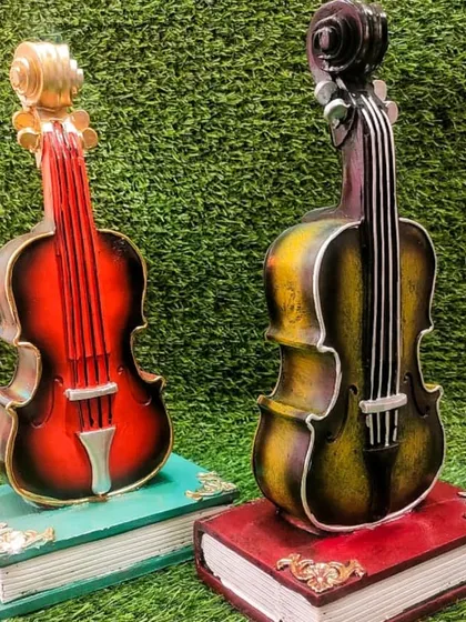 The guitar and violin piggy banks are available in multiple colors to suit any taste.