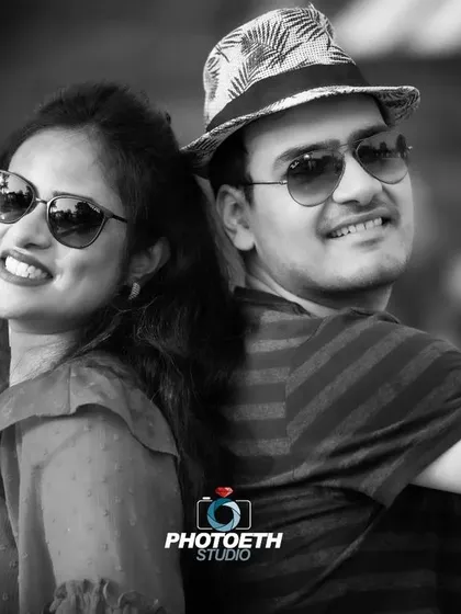 A classic black and white portrait that focuses on the couple's happy expressions. Sometimes, a simple, timeless shot is the most powerful.