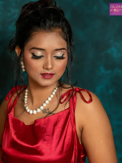 A classic party look with glittery eyes and a bold red lip. This is a timeless combination that we teach our students to perfect for any bridesmaid or party guest.