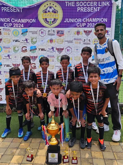 The champion U9 squad posing with their trophy and medals after winning the Juniors Football Cup 2024. A proud moment for the players, coaches, and the entire TFA family.