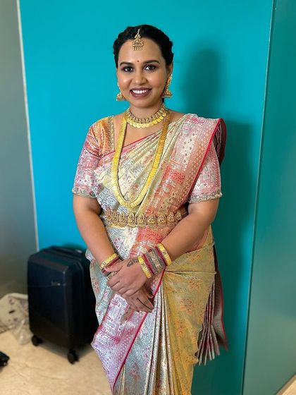 The complete look for the naming ceremony. The makeup is balanced to look beautiful in person and in photographs, celebrating the client's personal style.