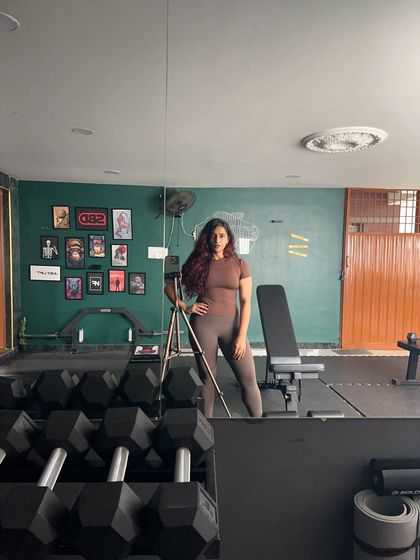 Just me, posing and flexing in my favorite place. This gym is my sanctuary, the place where I build my own strength and find my focus.