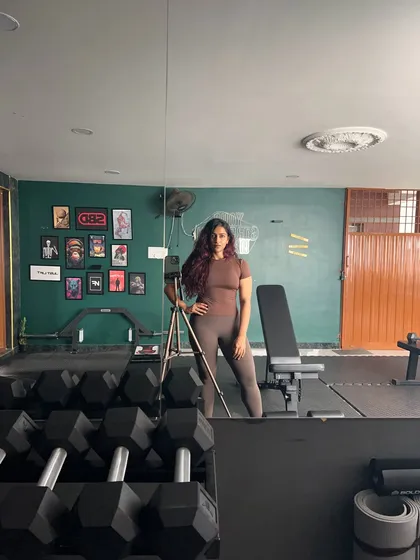 Just me, posing and flexing in my favorite place. This gym is my sanctuary, the place where I build my own strength and find my focus.