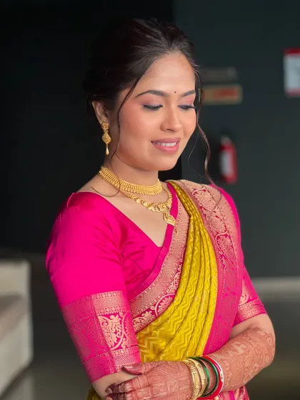 A close-up of my bride Shrishti's vidhi look, featuring soft, glowing makeup and a simple gold necklace.