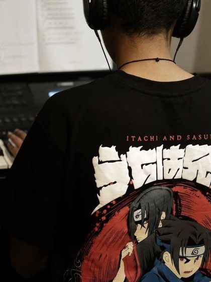 A student wearing a Naruto shirt while practicing piano. We love when students express their interests and feel at home in our classes.