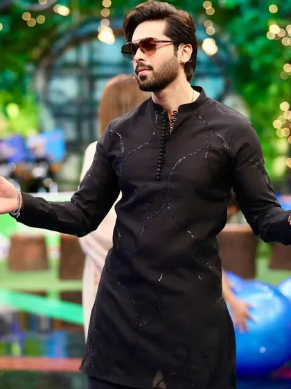 A simple black kurta with subtle, tonal black embroidery for an understated yet stylish look.