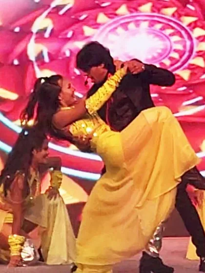 A classic Bollywood romantic pose during our performance. We bring the full range of cinematic emotions to the stage, from high-energy dance to romance.