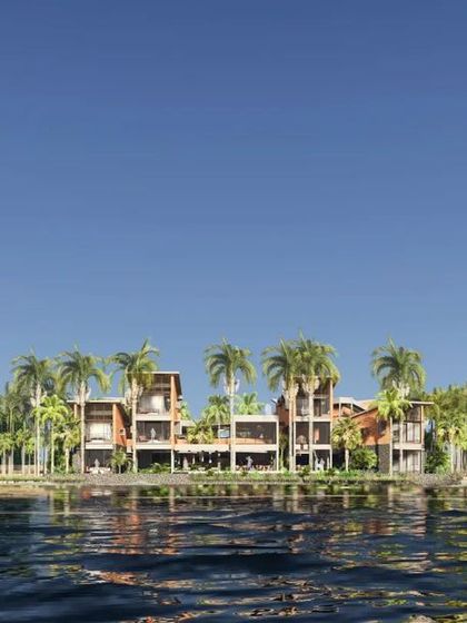 Another view of the Hoode retreat from the river, highlighting the light and airy quality of the architecture.