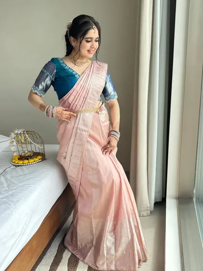 A full-length portrait of Payal, looking graceful and elegant by the window.