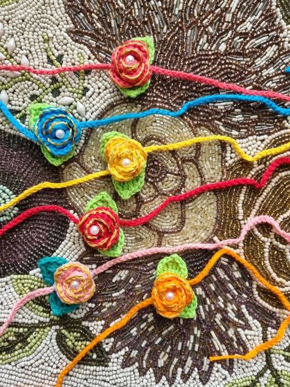 Our delicate rosebud rakhis come in a rainbow of colors. They are simple, elegant, and perfect for showing your love.