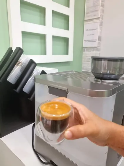 My espresso machine is the heart of my coffee bar. Here, a fresh shot of espresso is ready to be served in a double walled glass, keeping it hot while showing off its beautiful color.
