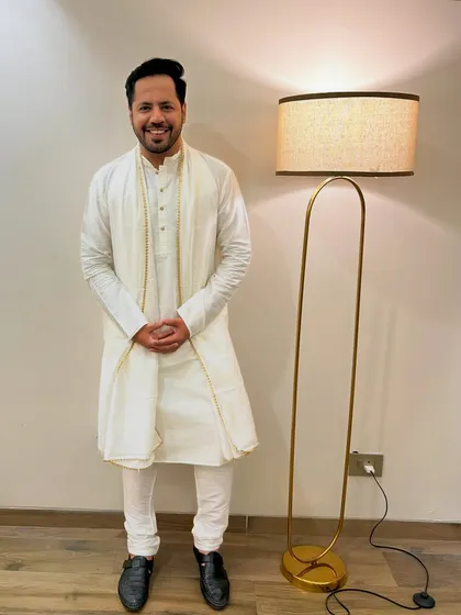 A full-length shot of the elegant white-on-white outfit. Perfect for a sophisticated morning event.