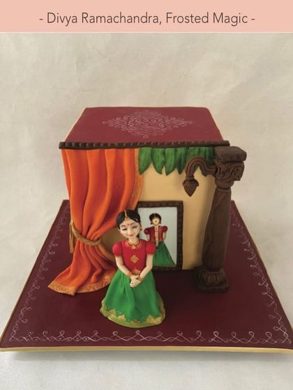 A closer look at my featured cake, showing the traditional Indian girl figurine and the detailed setting.
